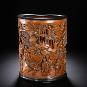 A FINE CARVED ANATTO-WOOD FIGURAL STORY BRUSHPOT