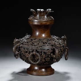 A BRONZE BALUSTER VASE WITH COVER