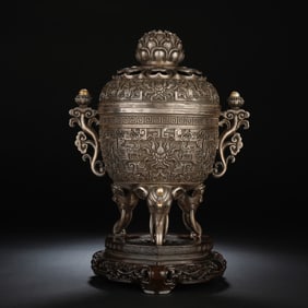 A SILVER INCENSE BURNER WITH COVER