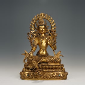A TIBETAN BRONZE-GILT FIGURE OF GREEN TARA