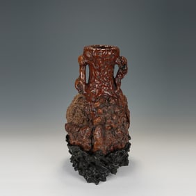 AN ANATTO-WOOD ROOT-FORM VASE