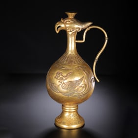 A BRONZE-GILT PHOENIX EWER