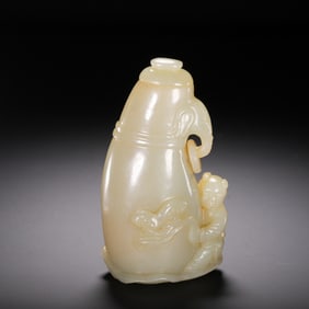 A CARVED WHITE JADE VASE WITH BOY