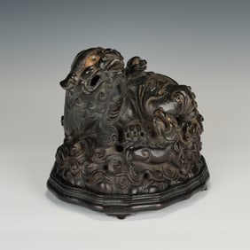 A CARVED ALOESWOOD CHENXIANG LIONS GROUP