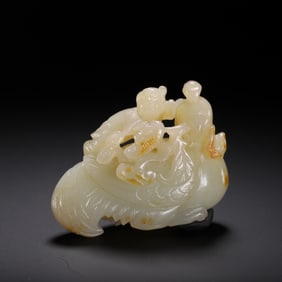 A CARVED WHITE JADE MYTHICAL BIRD