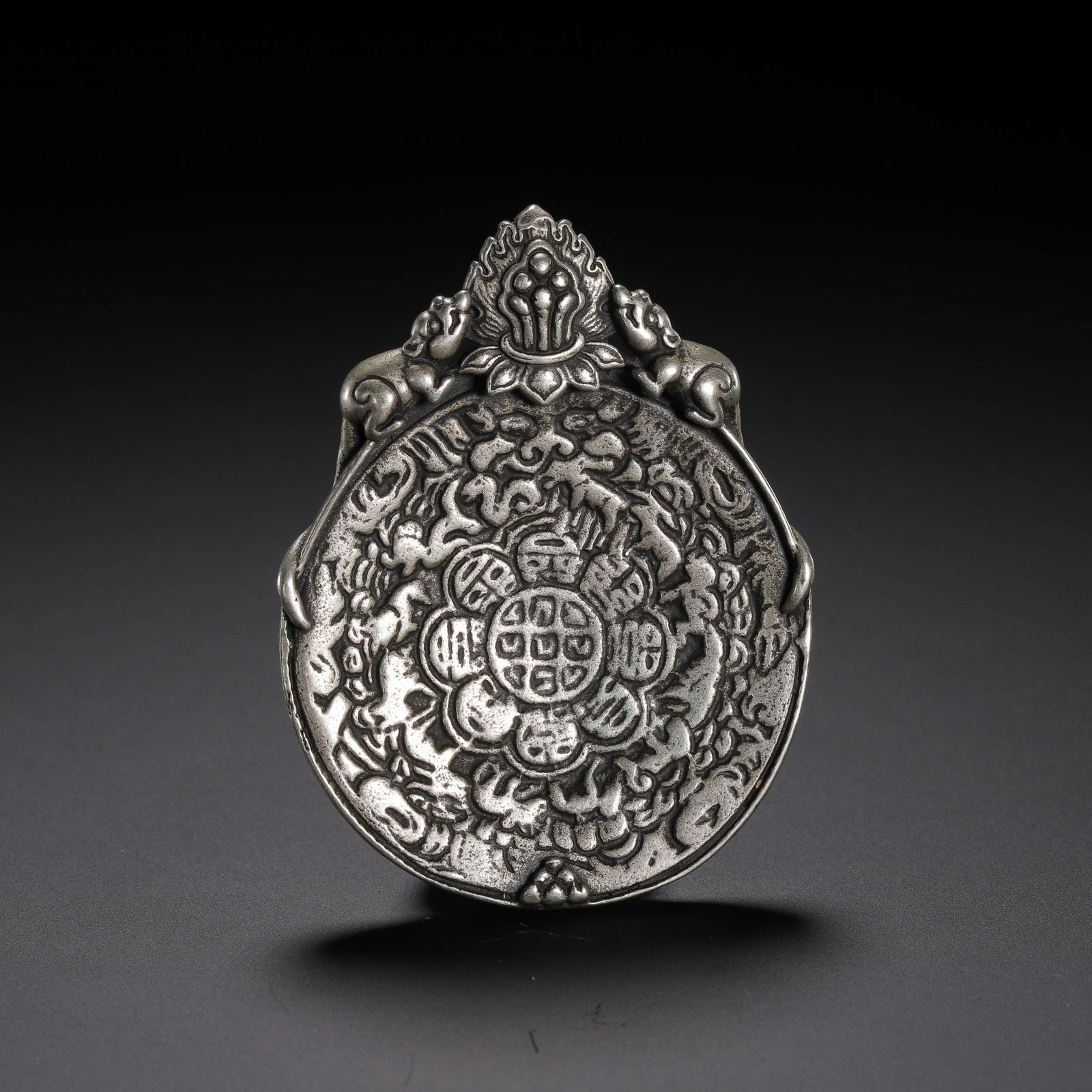 A TIBETAN COPPER AMULET (1 of 9)