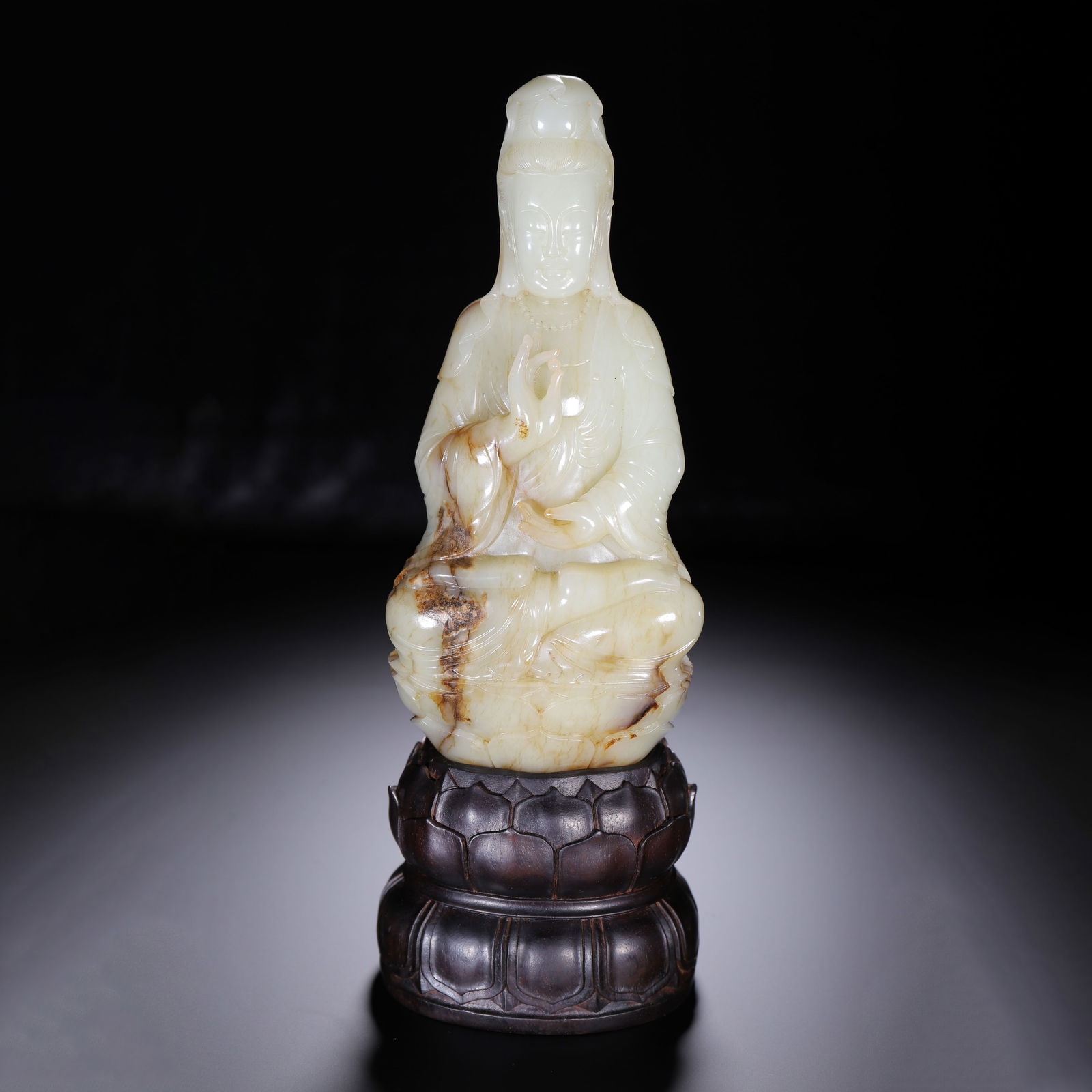 A CARVED WHITE JADE GUANYIN: A CARVED WHITE JADE GUANYIN Buddhism flourished during the Qing dynasty, and was encouraged by the devotion of the Kangxi, Yongzheng and Qianlong emperors. As a result of its popularity, the productio