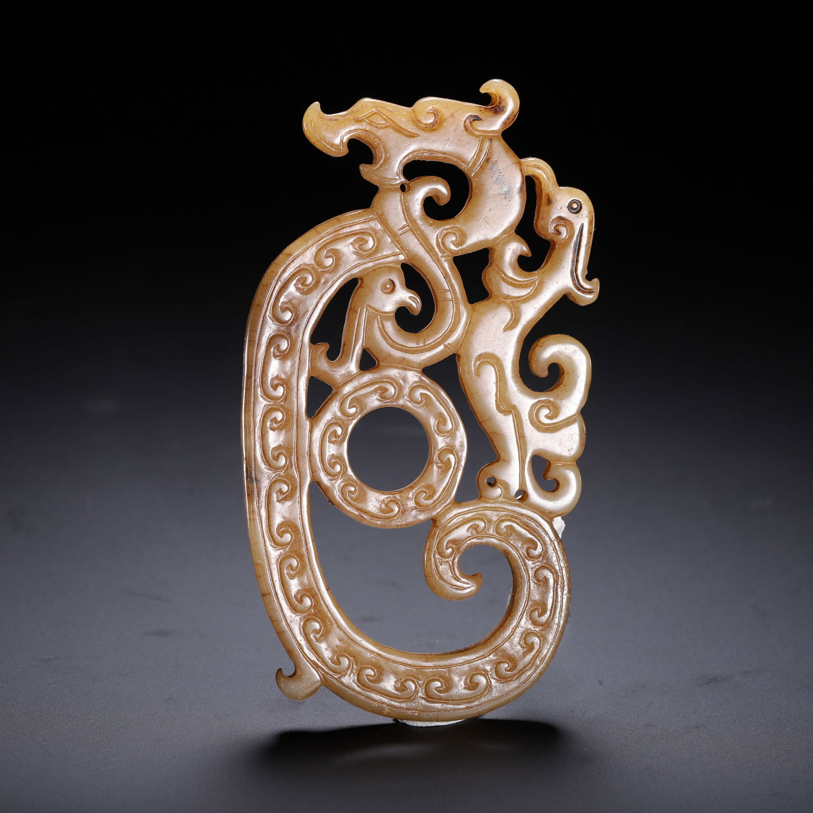 A CHINESE ARCHAISTIC CARVED JADE DRAGON (1 of 9)