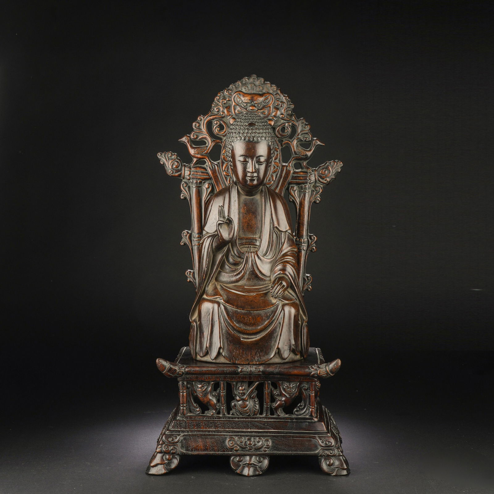 A CARVED ALOESWOOD CHENXIANG BUDDHA (1 of 10)
