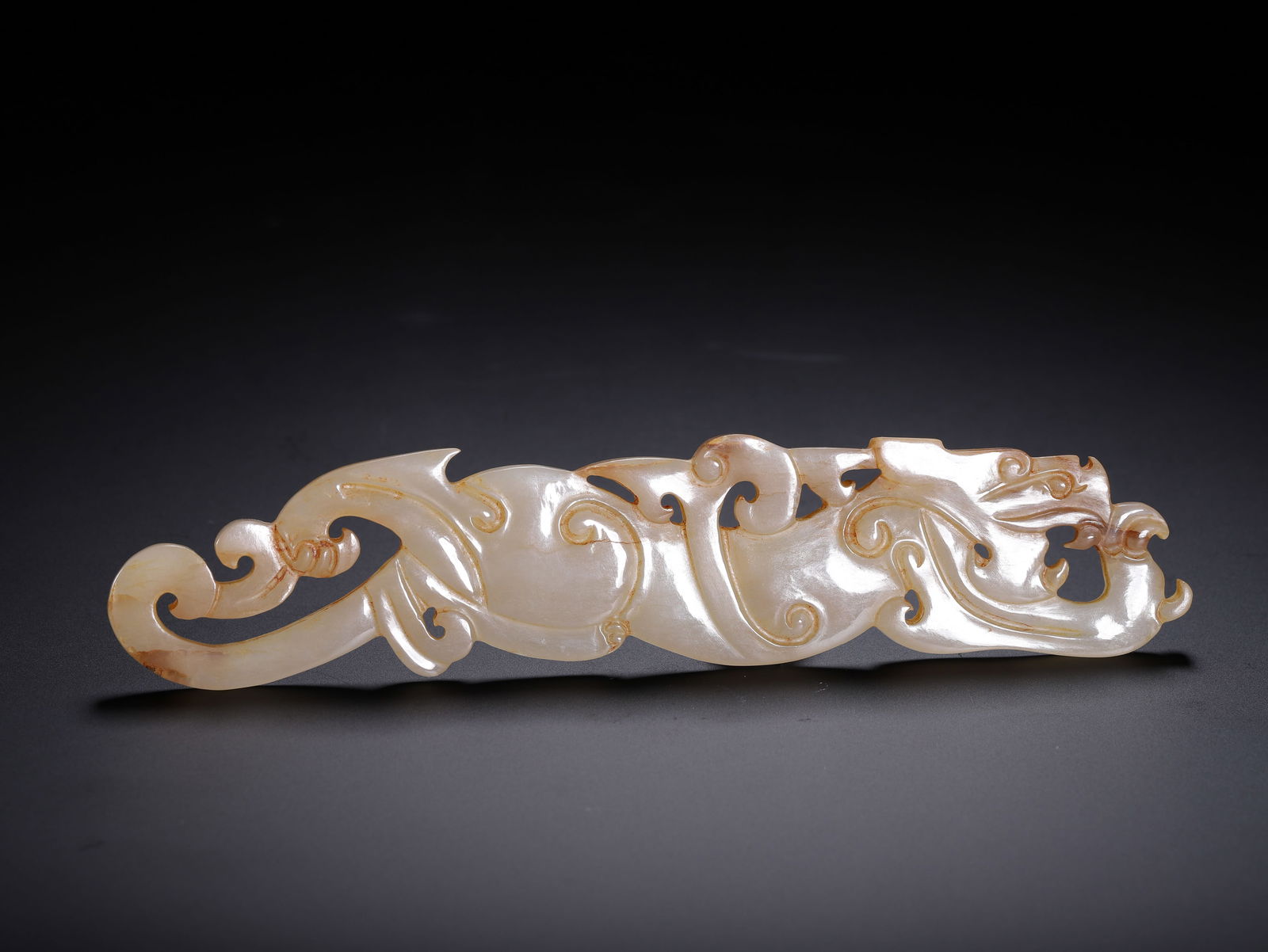 A CHINESE ARCHAISTIC CARVED JADE MYTHICAL BEAST (1 of 9)