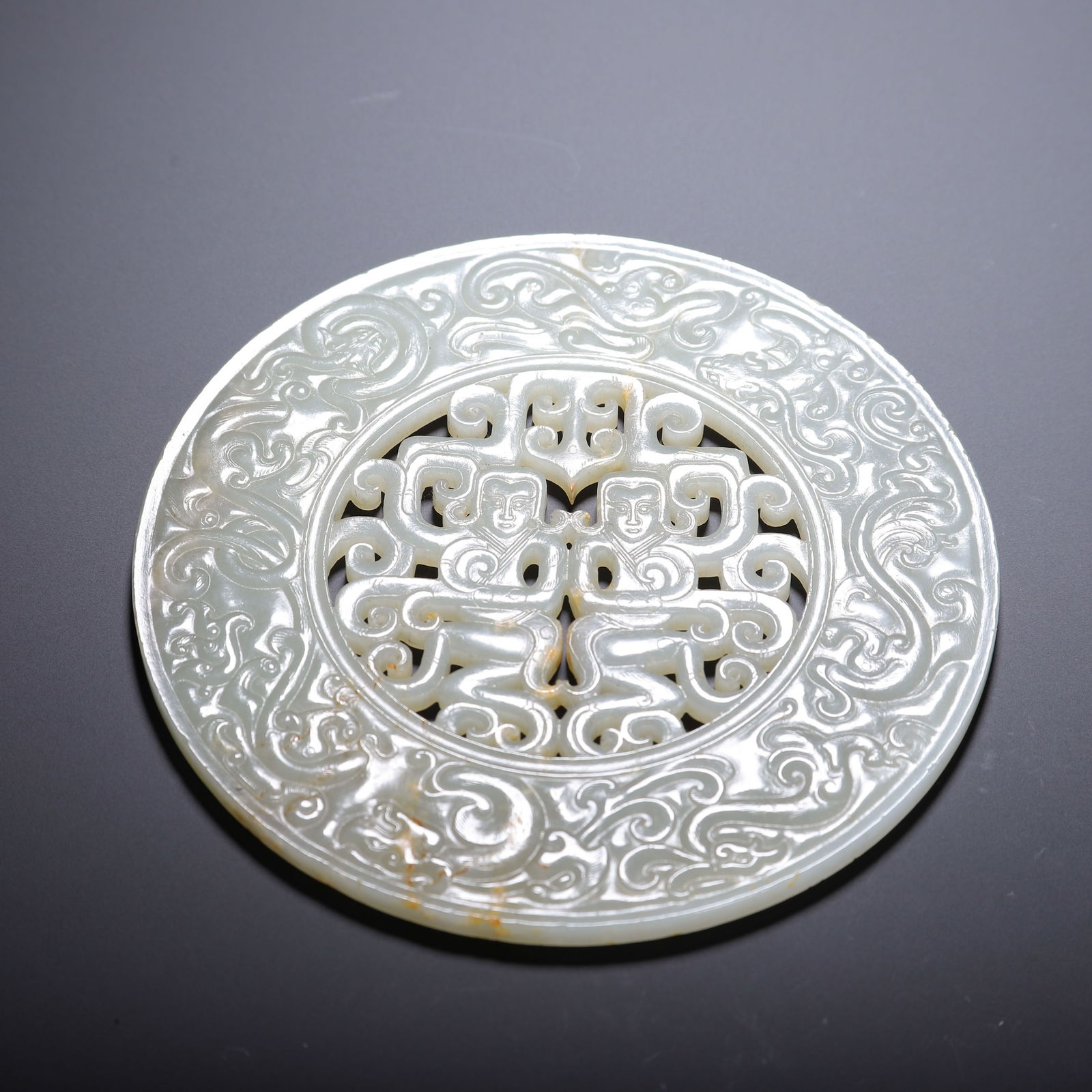 A CHINESE ARCHAISTIC CARVED WHITE JADE DISC BI (1 of 8)