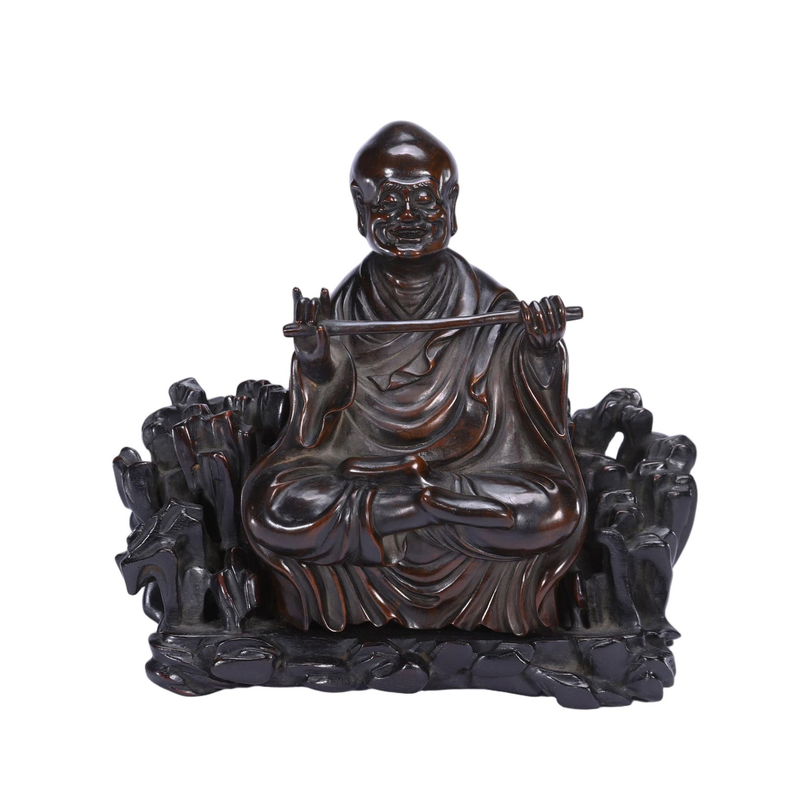 A CARVED ROSEWOOD ZITAN LUOHAN: A CARVED ROSEWOOD ZITAN LUOHAN The figure is carved with a naturalistic, benevolent expression, with his curly brows, mustache and beard rendered in undulating detail. He is carved wearing long, flowi