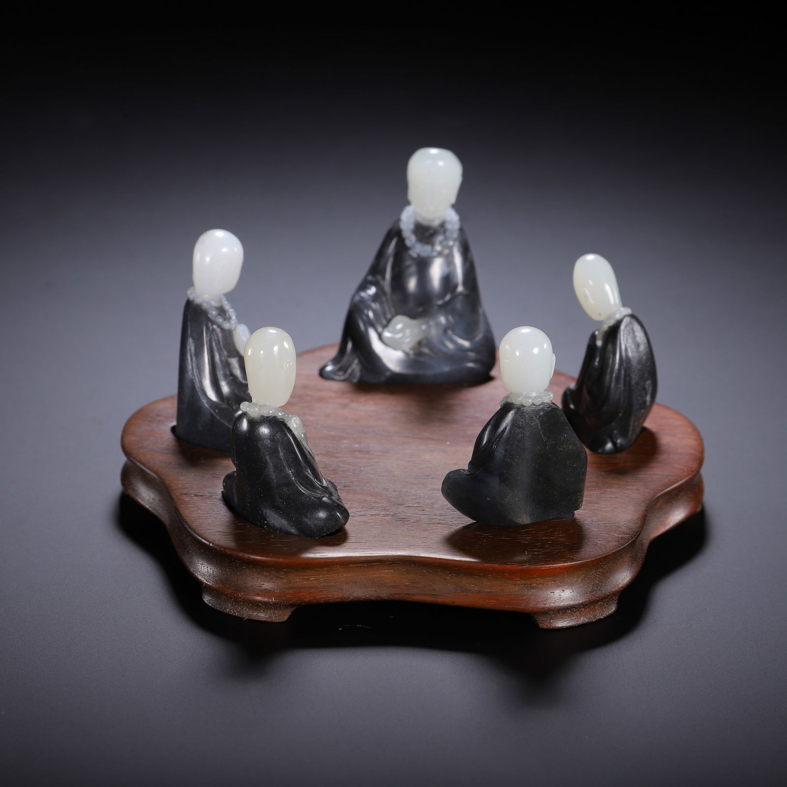 A SET OF JADE CARVINGS OF LUOHAN: A SET OF JADE CARVINGS OF LUOHAN Buddhism flourished during the Qing dynasty, and was encouraged by the devotion of the Kangxi, Yongzheng and Qianlong emperors. As a result of its popularity, the prod