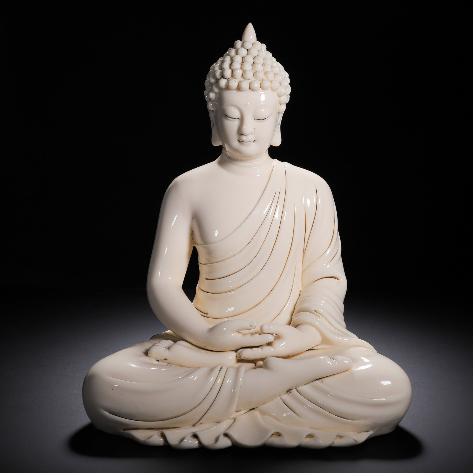 A BLANC-DE-CHINE SEATED AMITABHA (1 of 9)