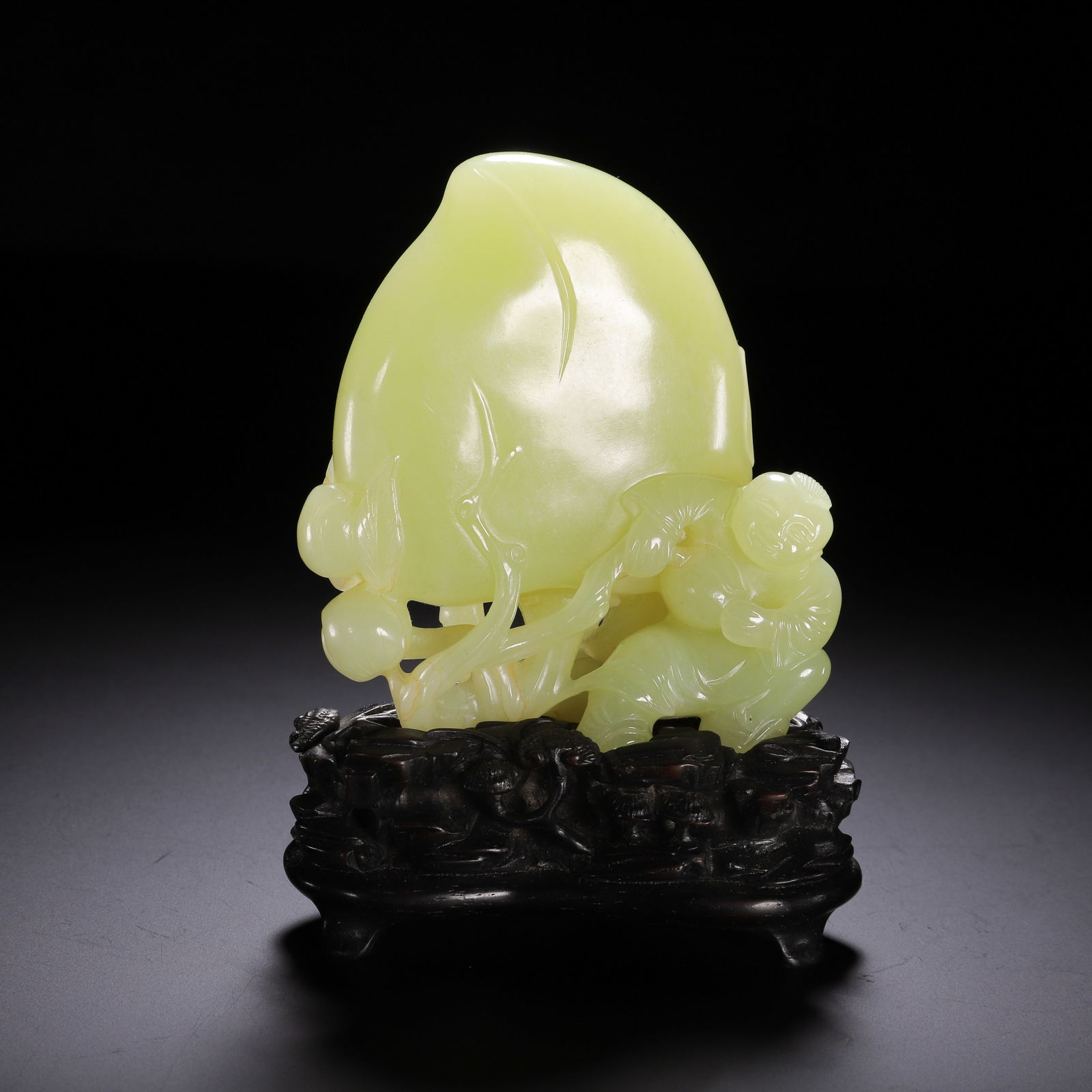 A CARVED YELLOW JADE PEACH DECORATION (1 of 9)