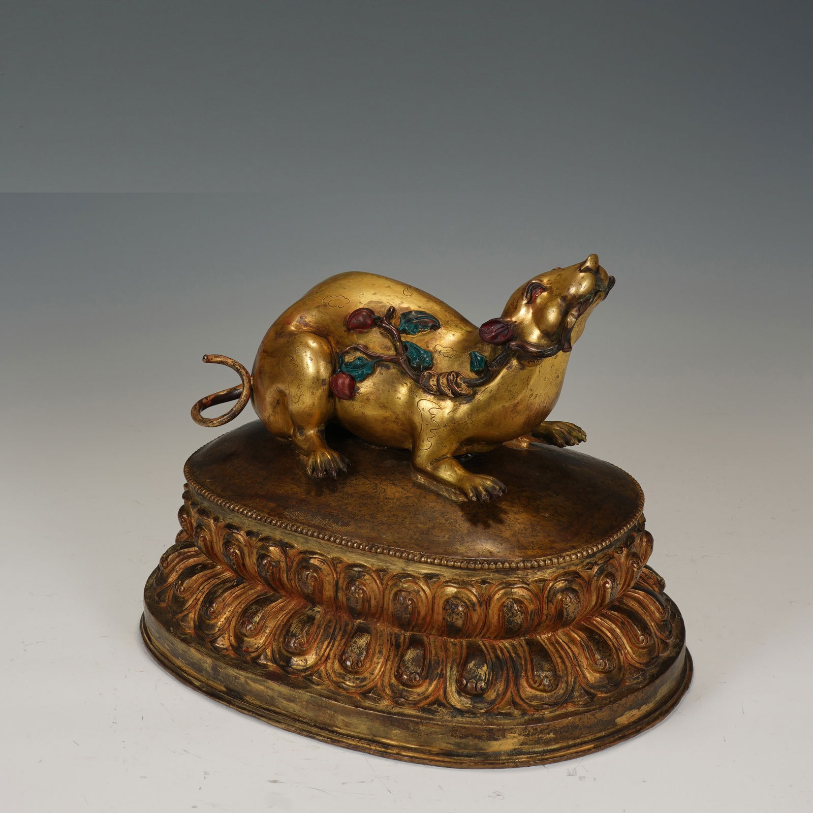 A BRONZE-GILT MONGOOSE: A BRONZE-GILT MONGOOSE The mongoose suppress demons and protect people’s wealth. Dimension: 41x28x32 cm. Weight 16750 grams.