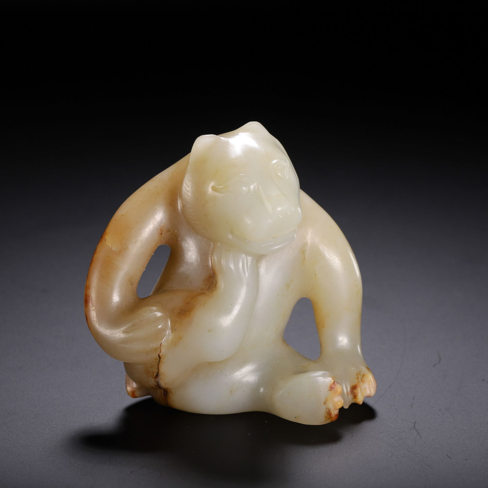 A CARVED WHITE JADE BEAR (1 of 9)