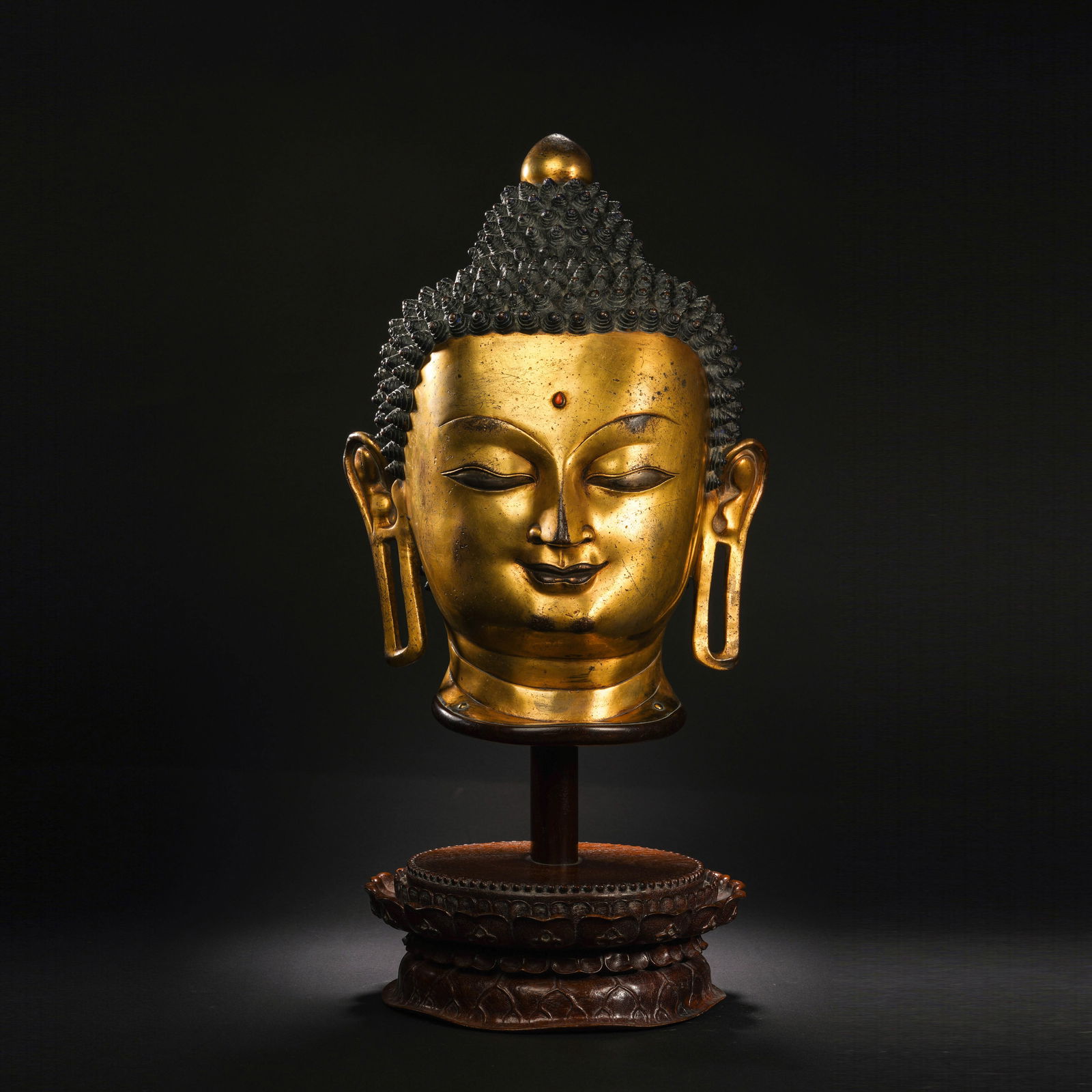 A BRONZE-GILT BUDDHA HEAD (1 of 11)