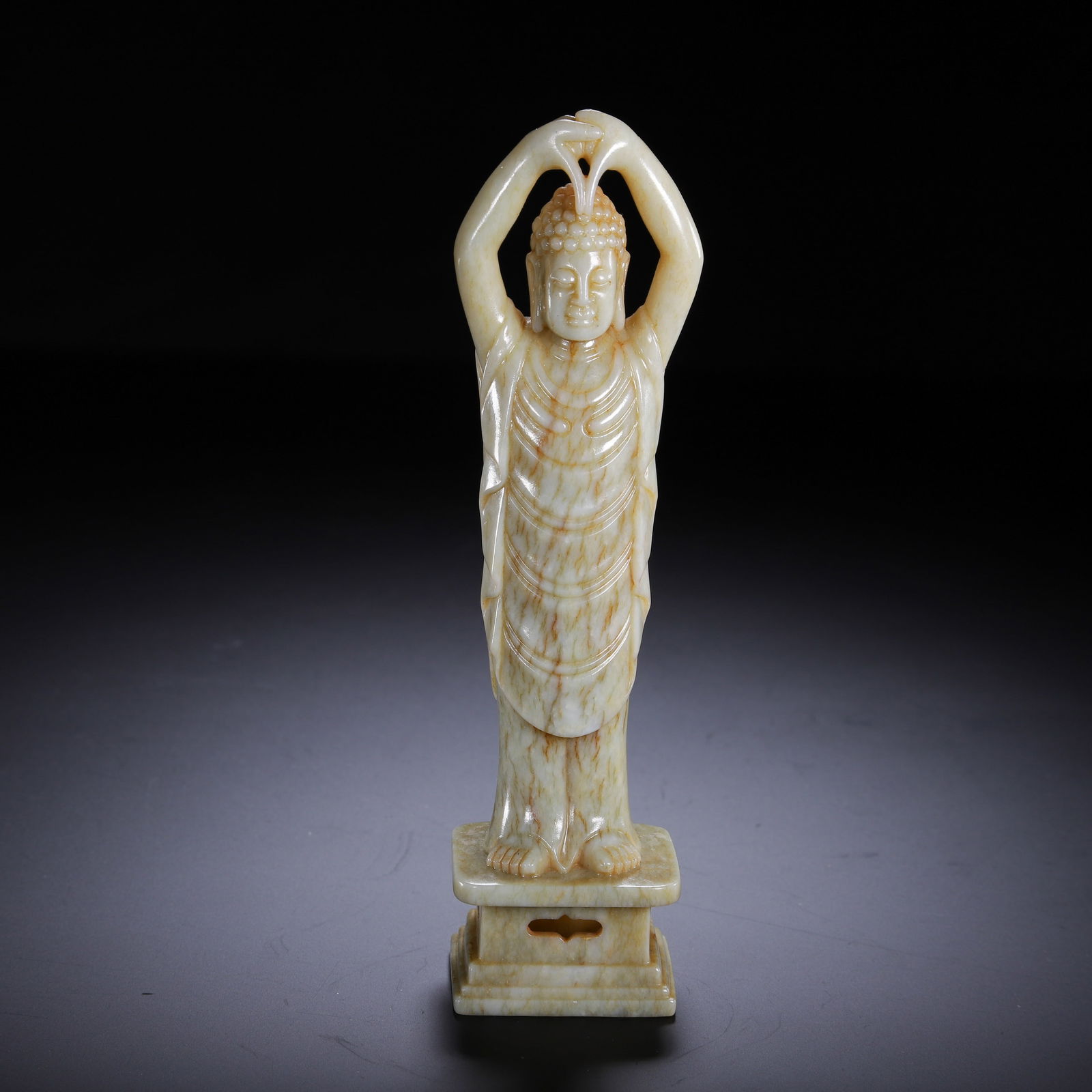 A CARVED WHITE JADE VAIROCANA (1 of 9)