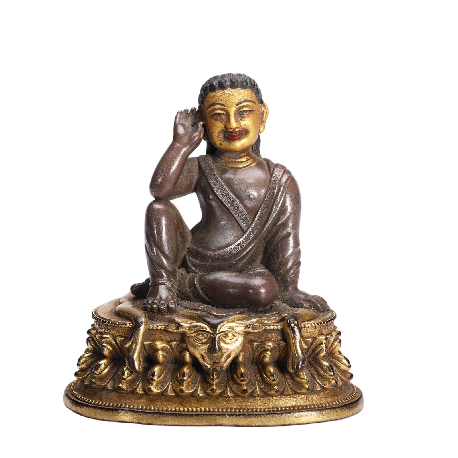 A BRONZE FIGURE OF MILAREPA: A BRONZE FIGURE OF MILAREPA Milarepa sits here in his most recognizable pose, with his right hand cupped behind his ear, identifies him as the Buddhist saint, Milarepa, whose melodious enlightened