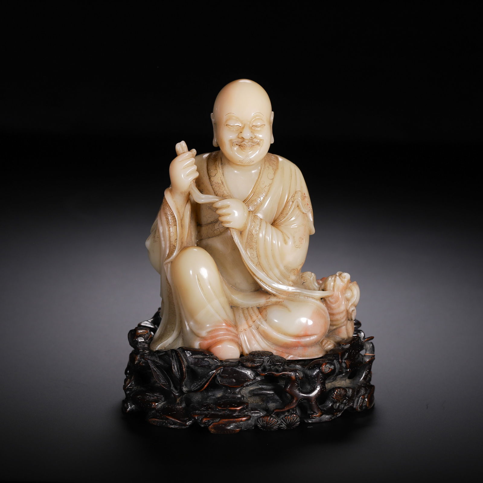 A CARVED SHOUSHAN STONE LUOHAN (1 of 9)