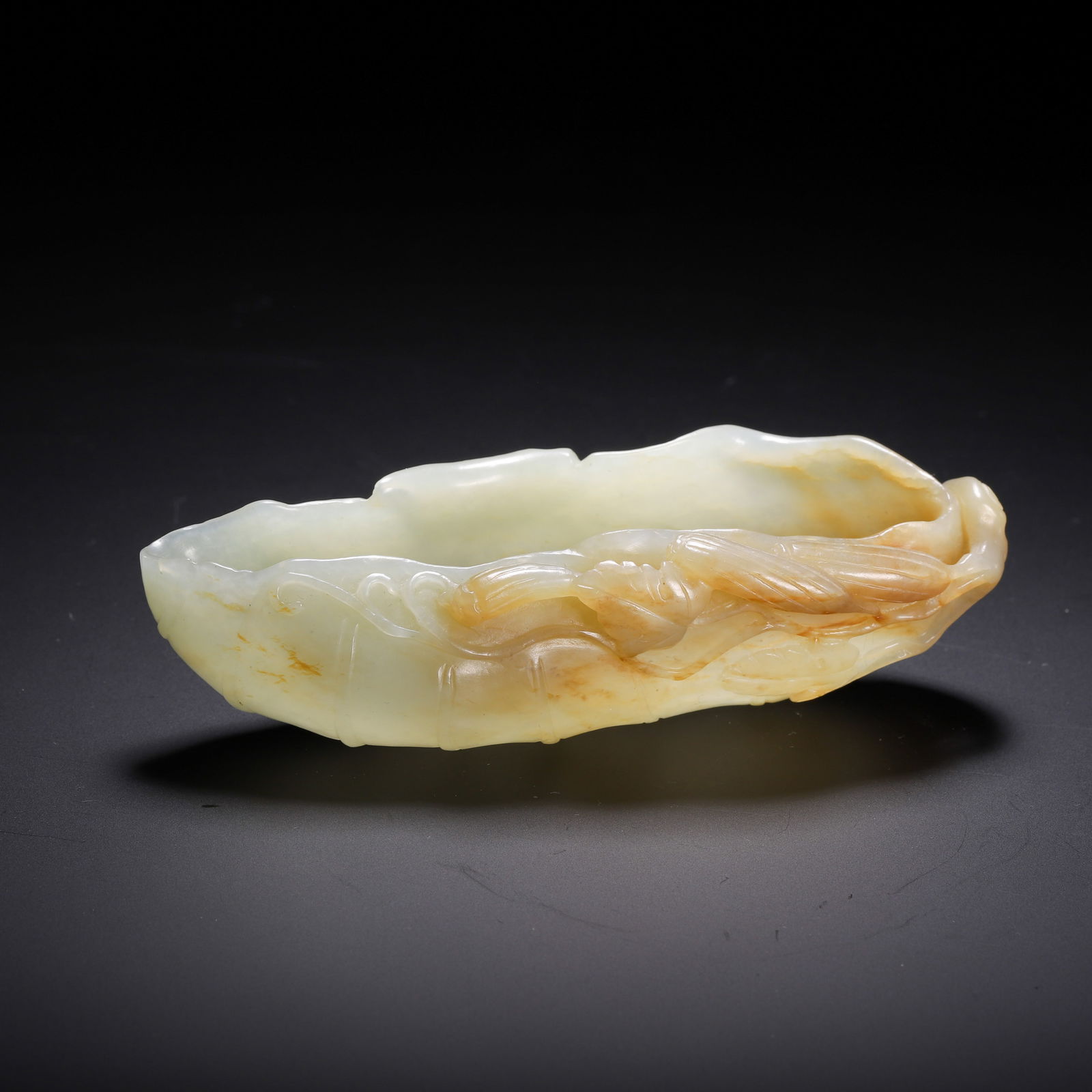 A CARVED WHITE JADE LEAF FORM WASHER (1 of 9)