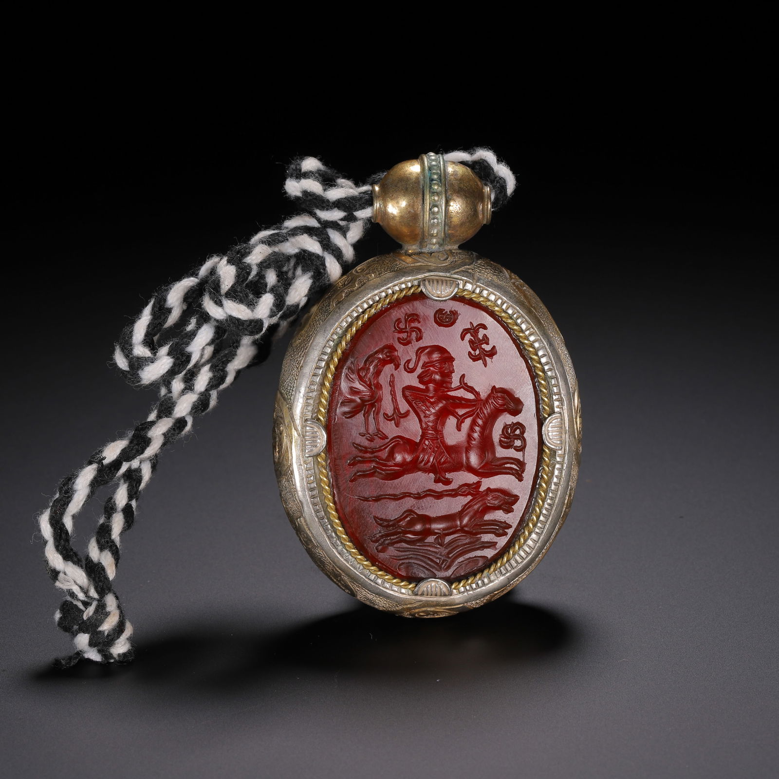 A CARVED AGATE PENDANT: A CARVED AGATE PENDANT Finely carved. Dimension: L. 8 cm. W. 5.36 cm. T. 1.96 cm.