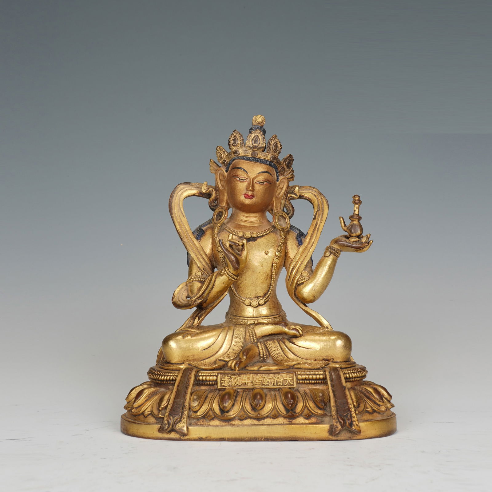 A BRONZE-GILT SEATED BODHISATTVA (1 of 8)
