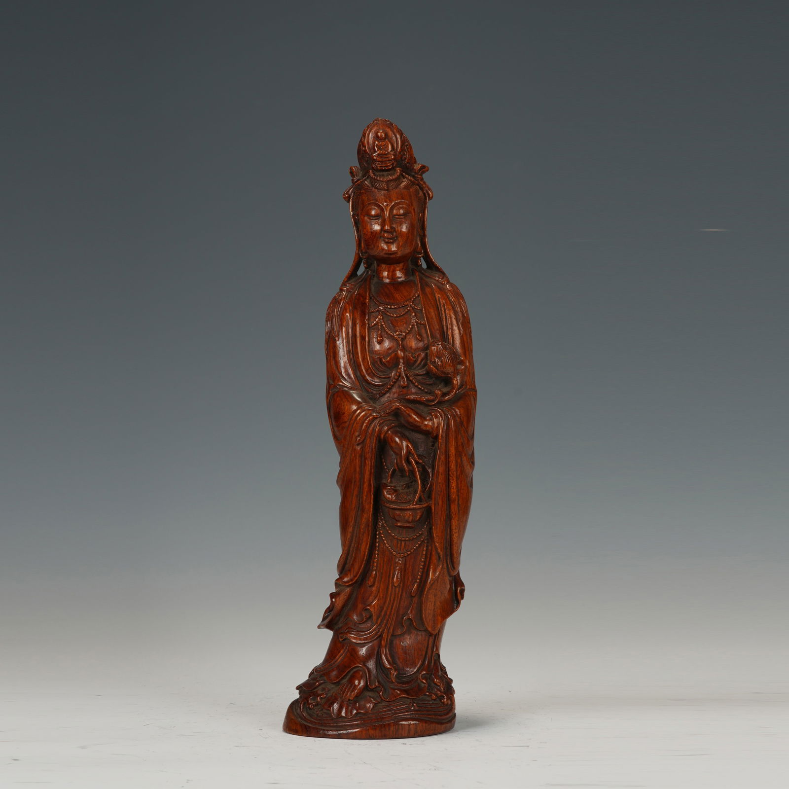 A CARVED HUANGHUALI STANDING GUANYIN (1 of 12)