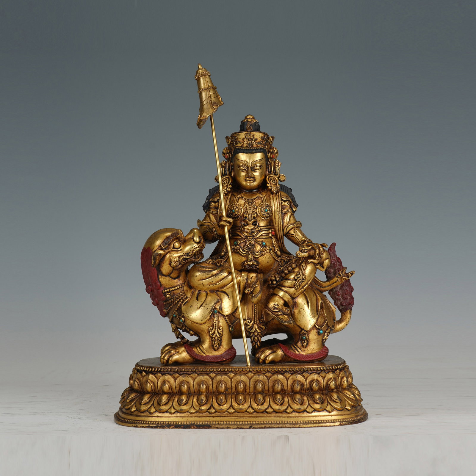 A BRONZE-GILT GOD OF WEALTH (1 of 9)