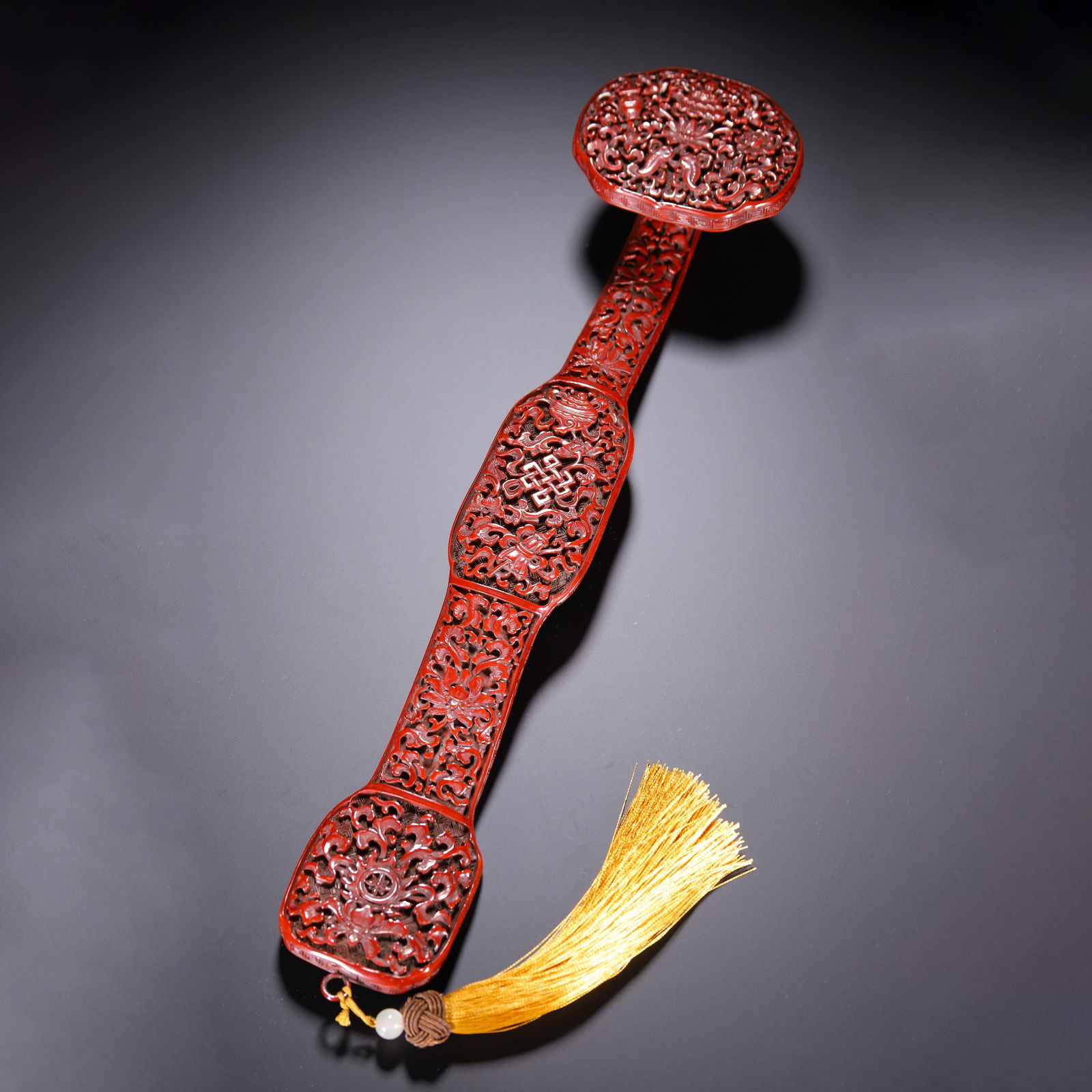 A CARVED CINNABAR LACQUER RUYI SCEPTER (1 of 9)