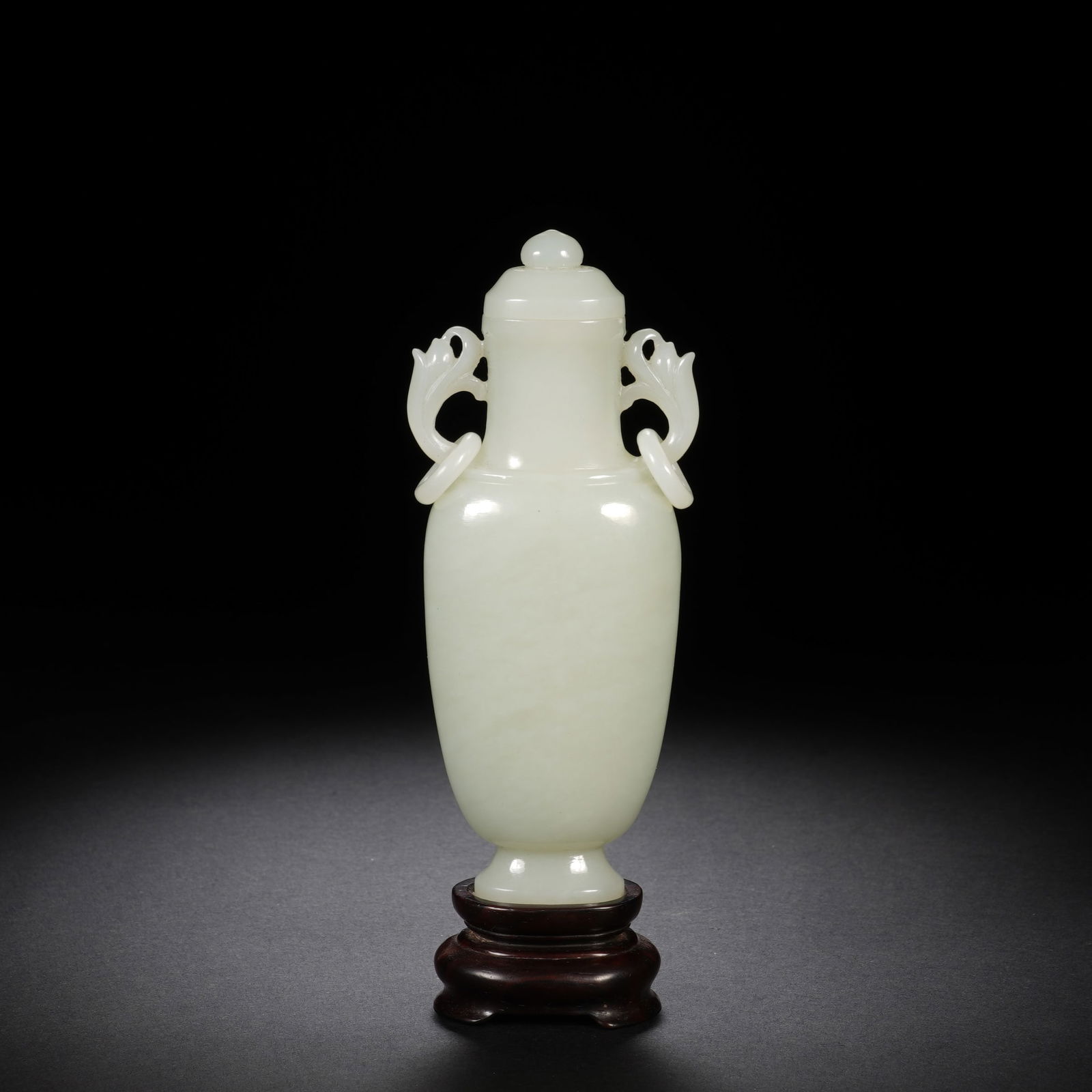 A CARVED WHITE JADE VASE (1 of 10)