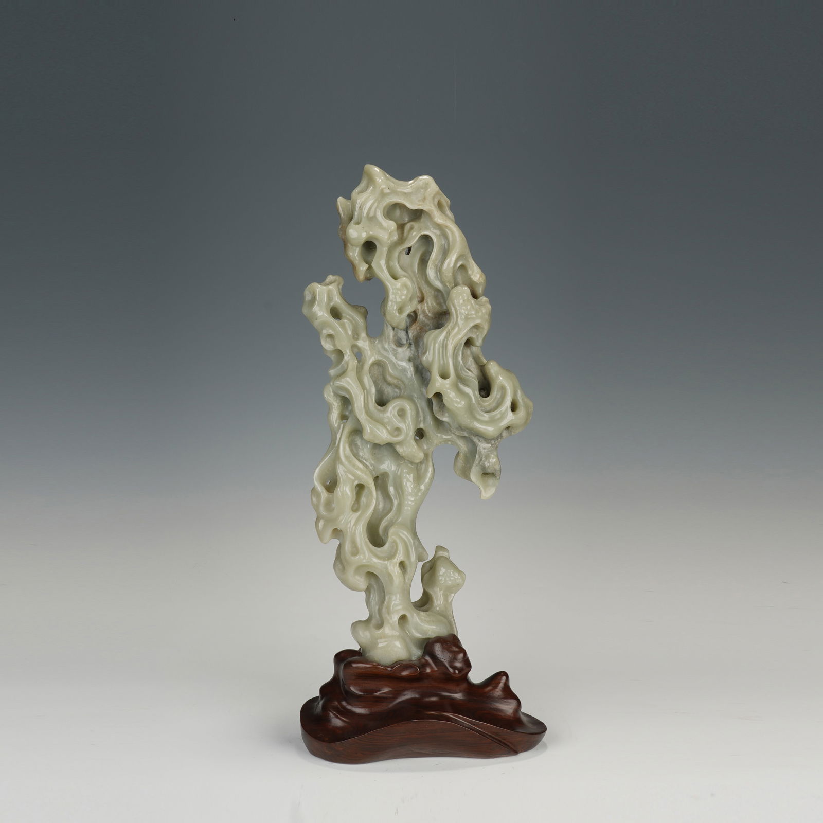 A CARVED WHITE JADE LITERATI ROCK (1 of 9)