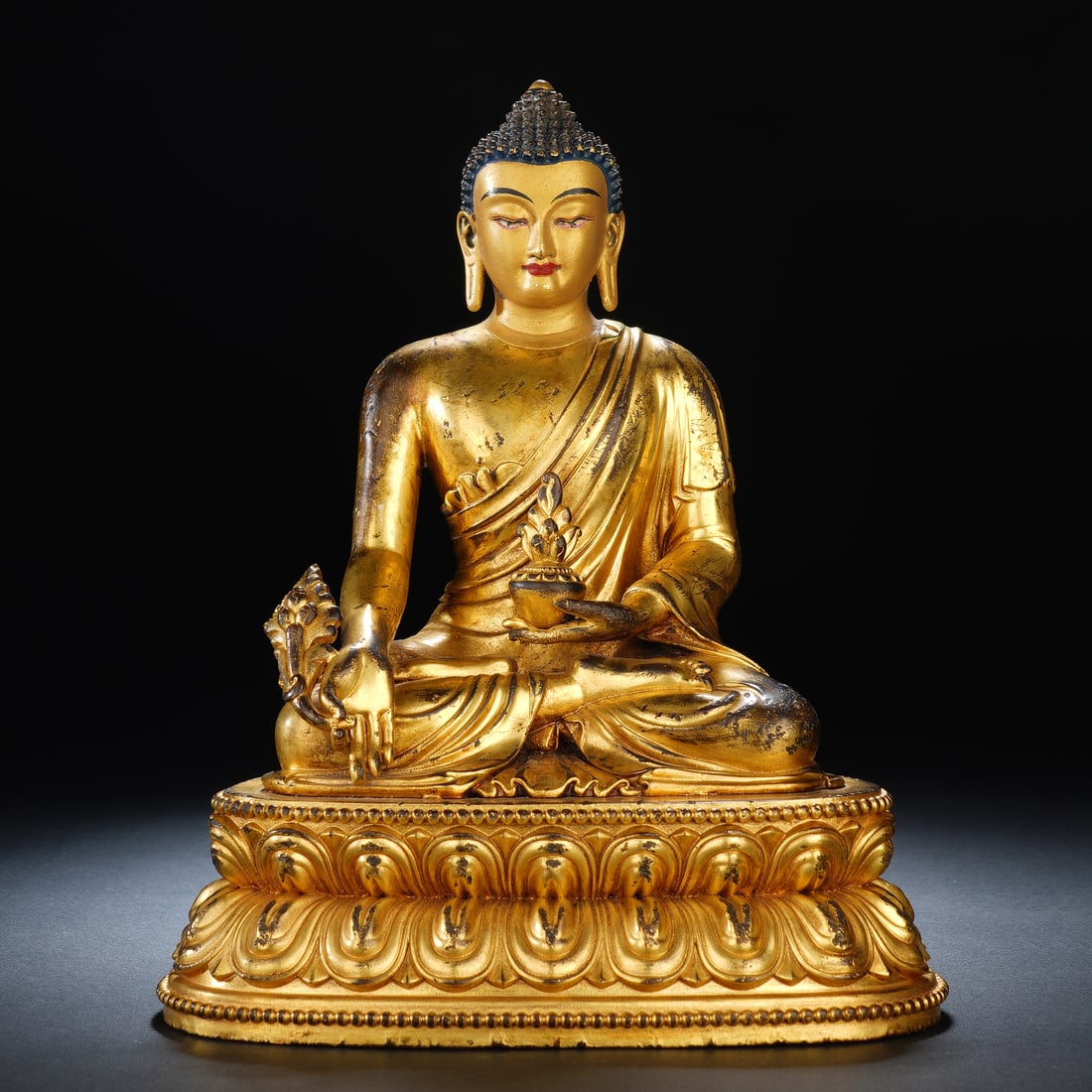 A CHINESE GILT-BRONZE MEDICINE BUDDHA (1 of 8)