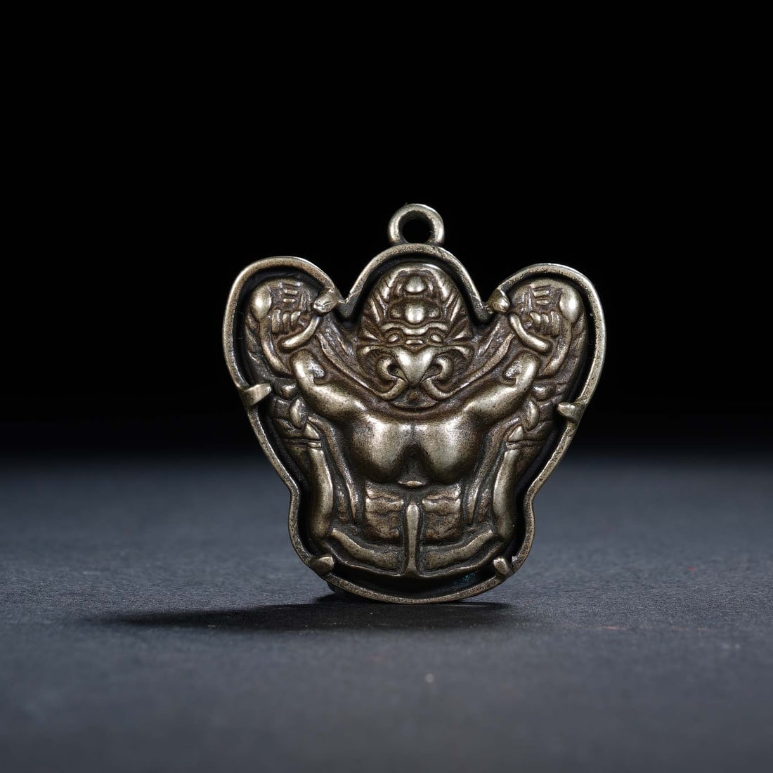 A CHINESE ALLOY GARUDA AMULET PENDANT (1 of 5)