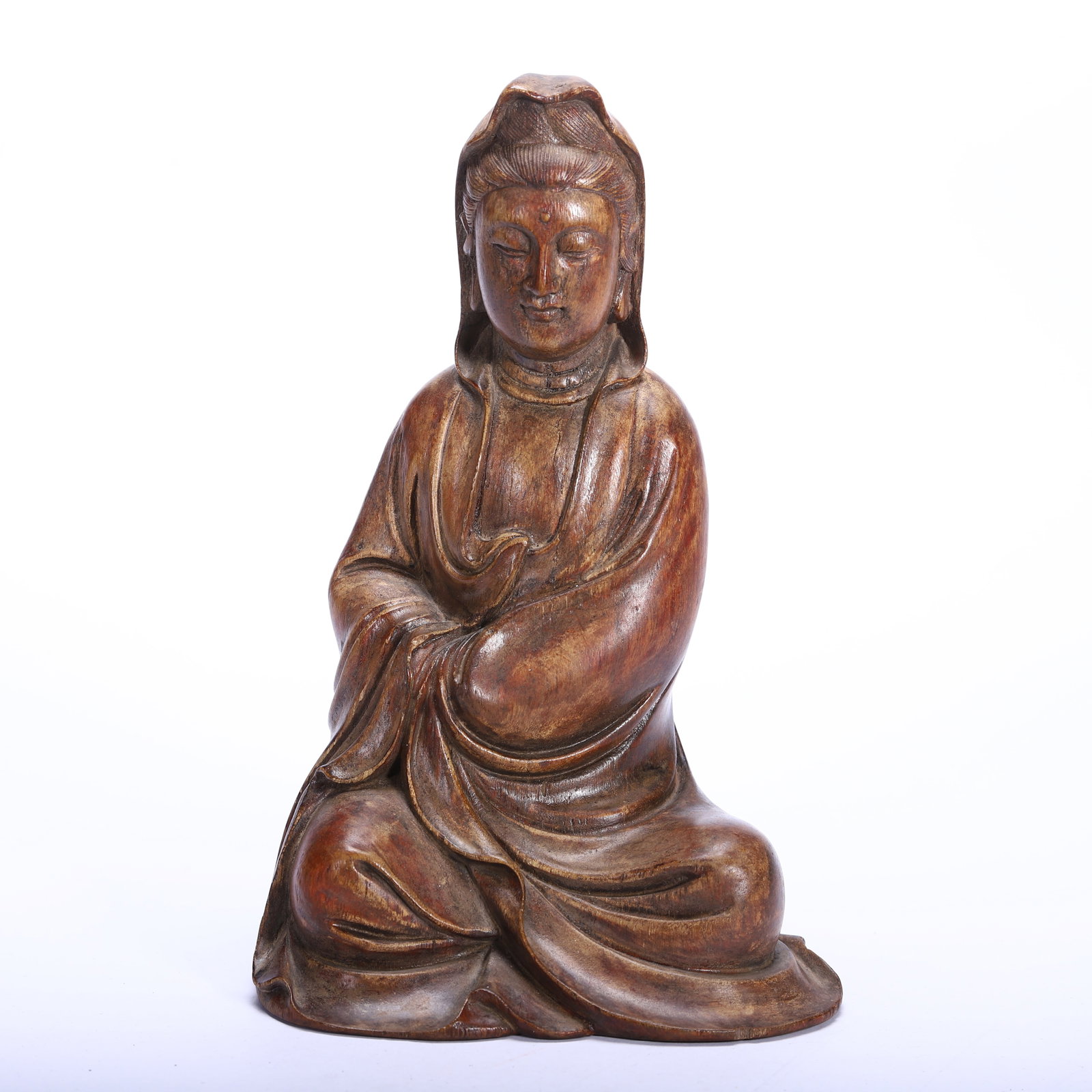 CHINESE HUANGHUALI WOOD SEATED GUANYIN FIGURE: CHINESE HUANGHUALI WOOD SEATED GUANYIN FIGURE A Chinese Huanghuali wood seated Guanyin figure, measuring 12 cm in length, 9 cm in width, 19 cm in height, and weighing 220 grams. Carved from a single p