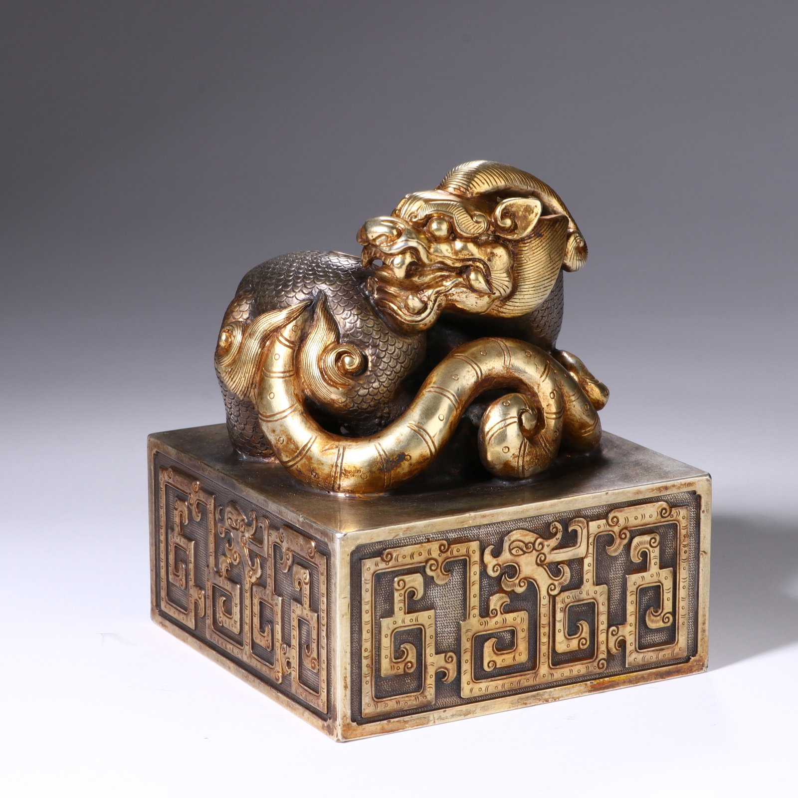 A CHINESE GILT-BRONZE BEAST-HANDLE SEAL (1 of 7)