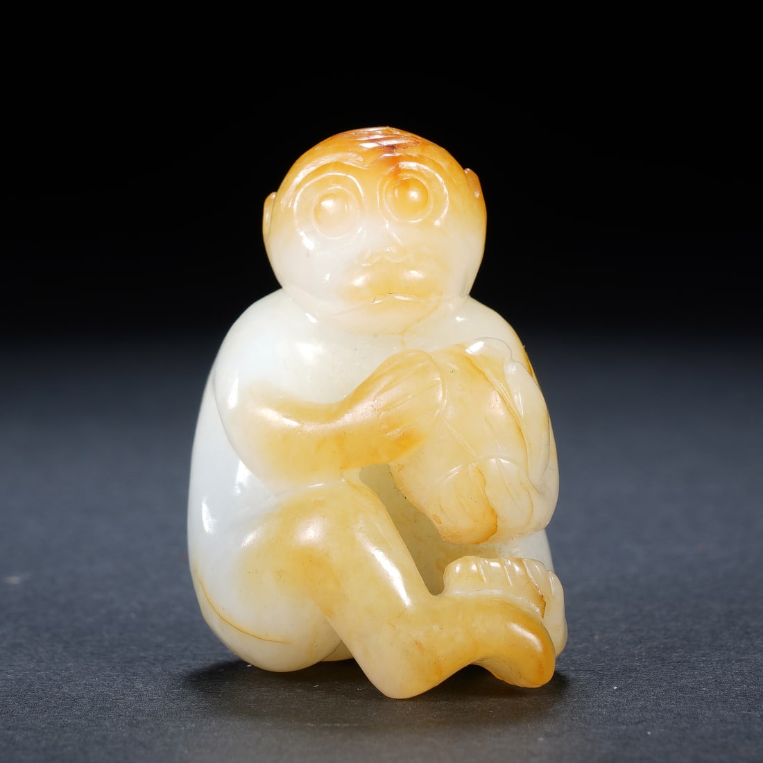 A CHINESE WHITE JADE MONKEY OFFERING LONGEVITY (1 of 6)