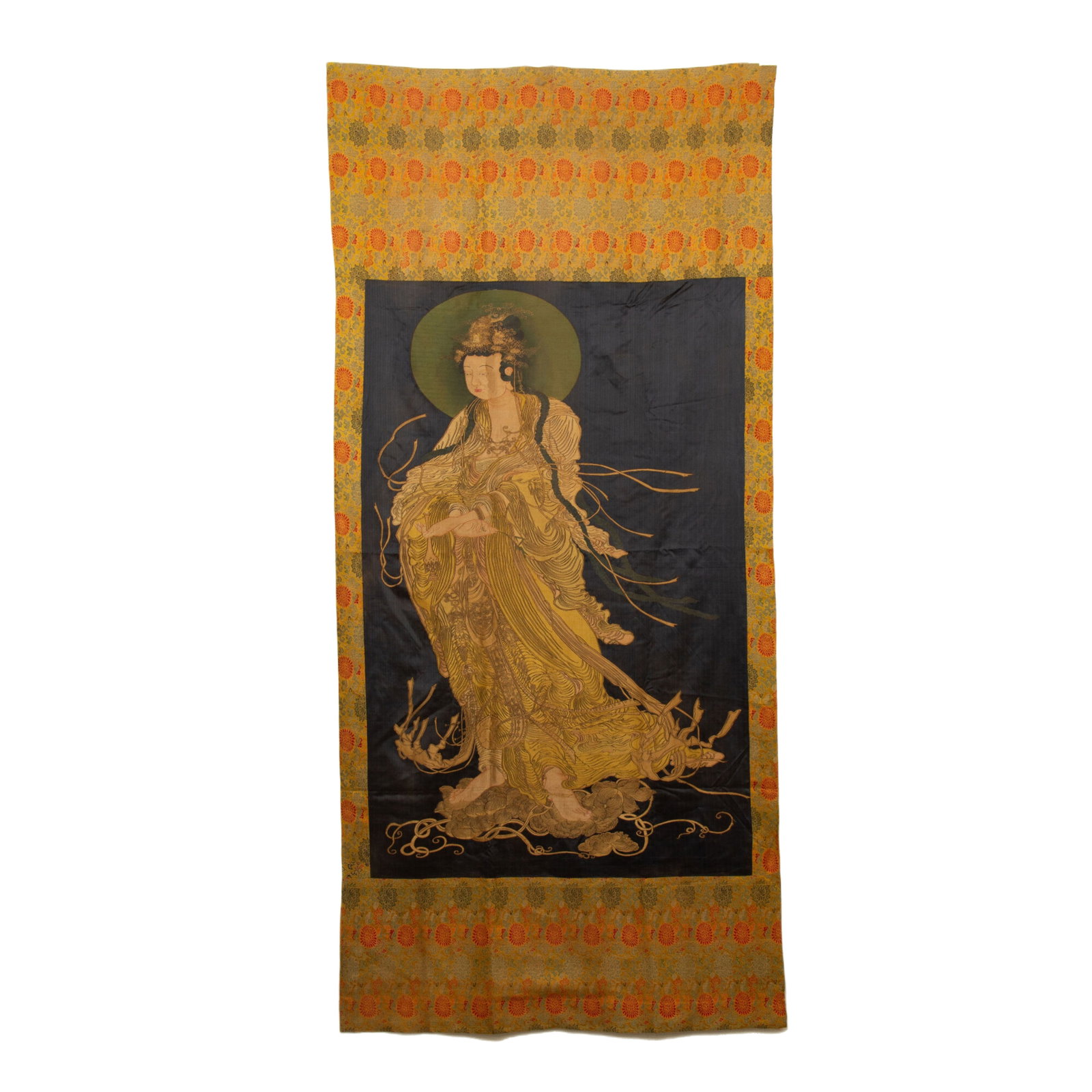 Chinese Kesi Guanyin Tapestry: Chinese Kesi Guanyin Tapestry This is a fine Chinese kesi tapestry depicting Guanyin, measuring 234 cm in length and 107 cm in width. The central panel features a full-length image of the deity, rende