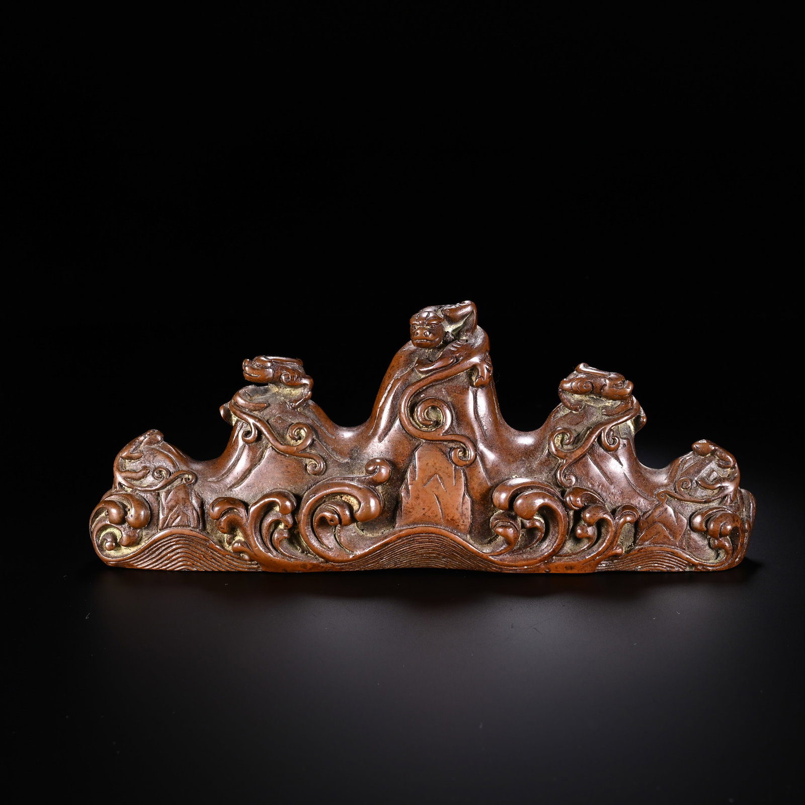 Chinese Bronze Dragon-Form Brush Rest: Chinese Bronze Dragon-Form Brush Rest This finely cast bronze brush rest measures 7.5 cm in height and 18 cm in width. Shaped like a stylized mountain range, it features five peaks adorned with intric