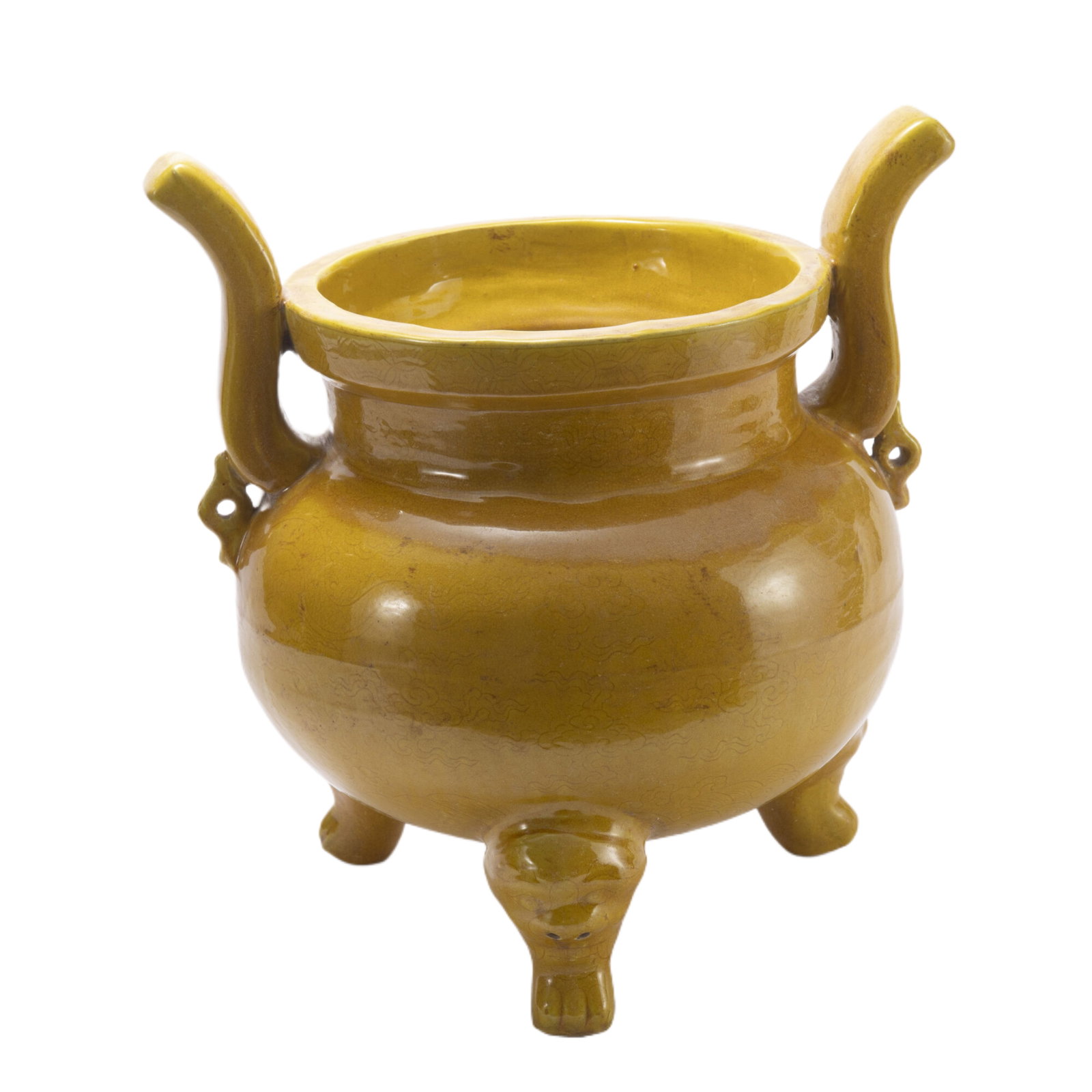 A CHINESE YELLOW GLAZED PORCELAIN TRIPOD INCENSE BURNER: A CHINESE YELLOW GLAZED PORCELAIN TRIPOD INCENSE BURNER The censer is raised on three beast head supports and flanked by pair upright handles on body, applied overall in yellow glaze. Dimension: L. 37