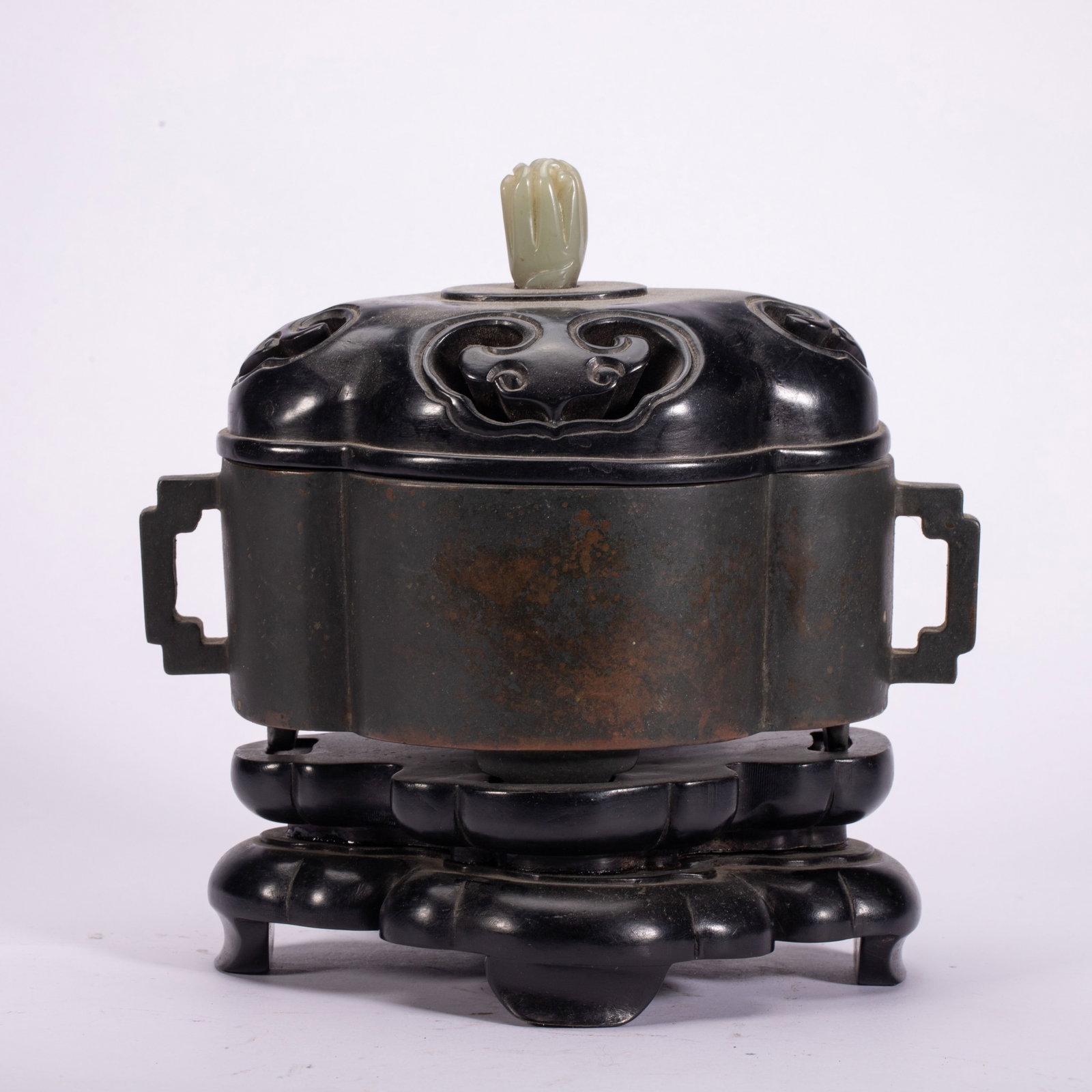 Chinese Bronze Censer with Jade Finial and Stand: Chinese Bronze Censer with Jade Finial and Stand This elegant bronze censer measures 18.5 cm in length, 12 cm in width, 18 cm in height, and weighs 2540 grams. The lobed body is flanked by two geometr
