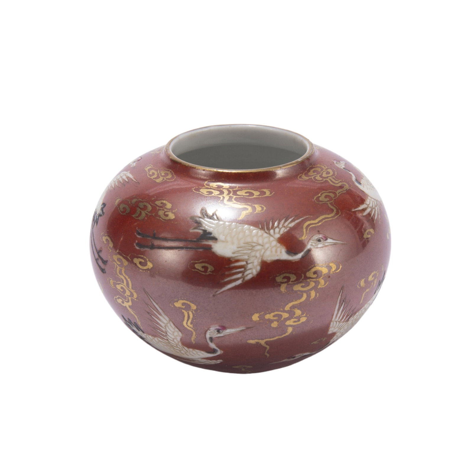 A CHINESE FAMILLE ROSE PORCELAIN WATER POT: A CHINESE FAMILLE ROSE PORCELAIN WATER POT Of ovoid shape, the exterior painted with cranes and swirling clouds against red ground. Dimension: L. 9.5 cm. H. 1.8 cm. Weight 30 grams.