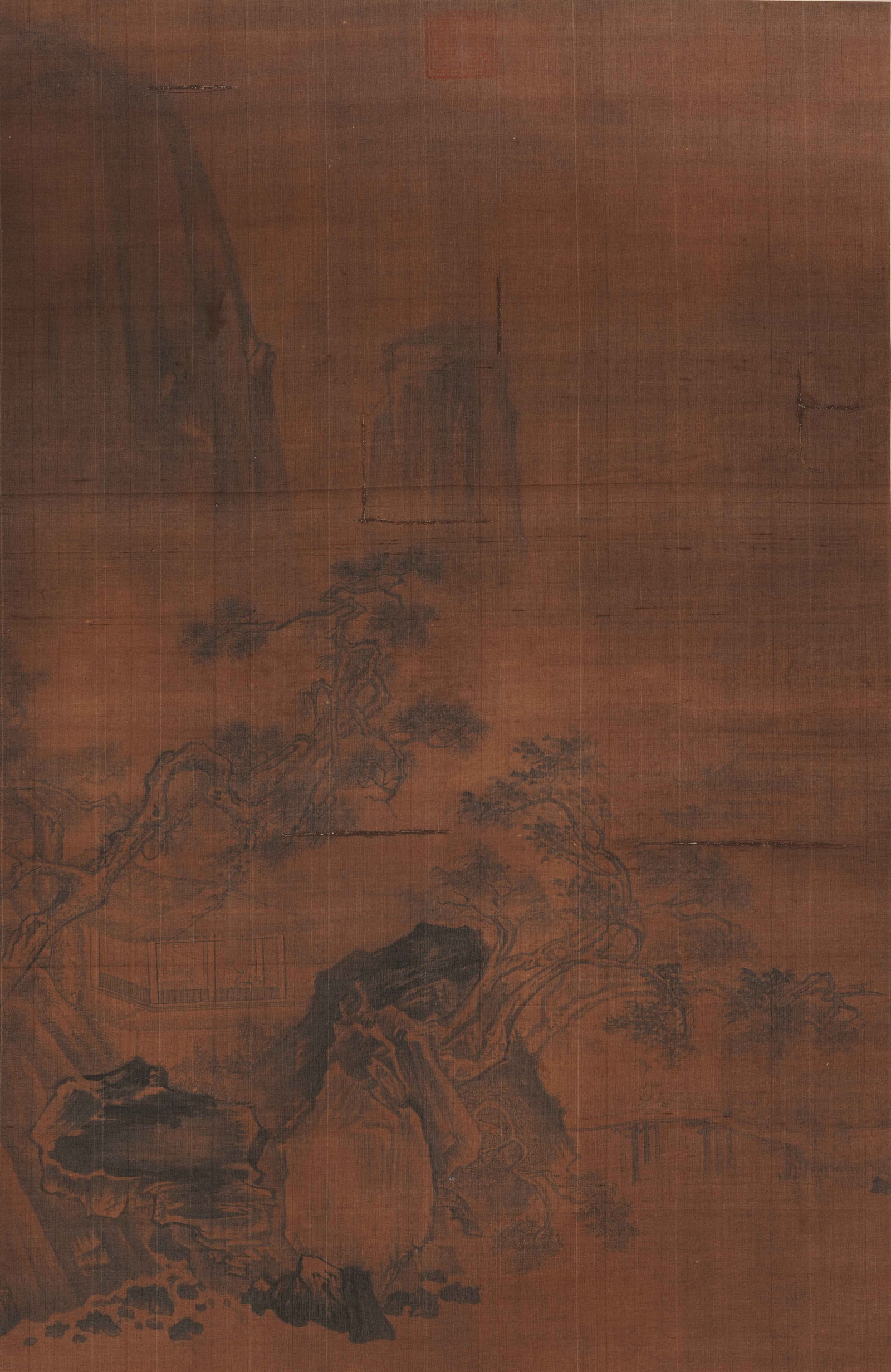 A CHINESE CLASSICAL LANDSCAPE PAINTING, ANONYMOUS: A CHINESE CLASSICAL LANDSCAPE PAINTING, ANONYMOUS Ink on silk, hanging scroll. This anonymous monochromatic landscape depicts a serene misty mountain scene, featuring gnarled pine trees, a secluded pa