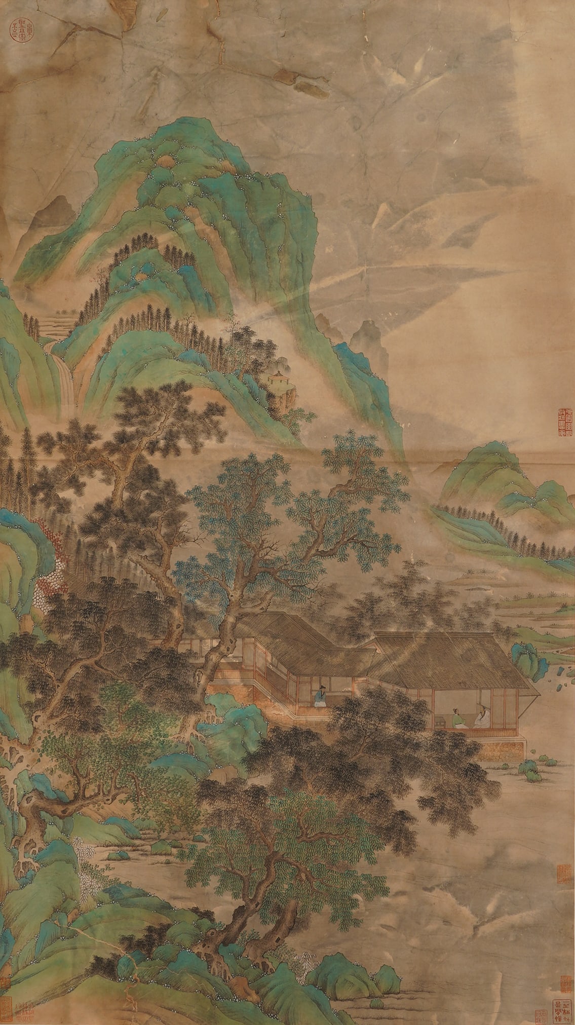 A CHINESE GREEN AND BLUE LANDSCAPE PAINTING, ANONYMOUS: A CHINESE GREEN AND BLUE LANDSCAPE PAINTING, ANONYMOUS Ink and colour on silk, hanging scroll. This exquisite anonymous work is a fine example of the traditional blue-and-green landscape style. It