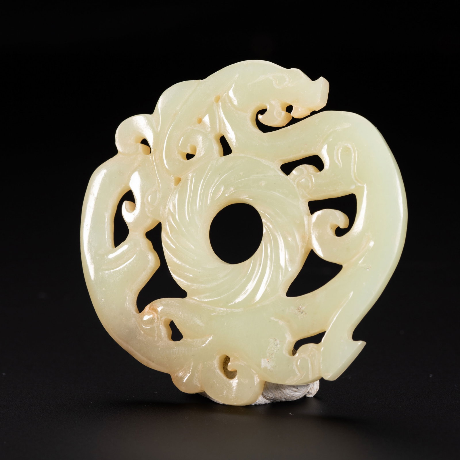 Chinese Hetian Jade Double Dragon Pendant: Chinese Hetian Jade Double Dragon Pendant This is an elegant Chinese Hetian jade pendant, measuring 5.5 cm in diameter and weighing 20 grams. The pendant is carved from a smooth, pale yellowish-green
