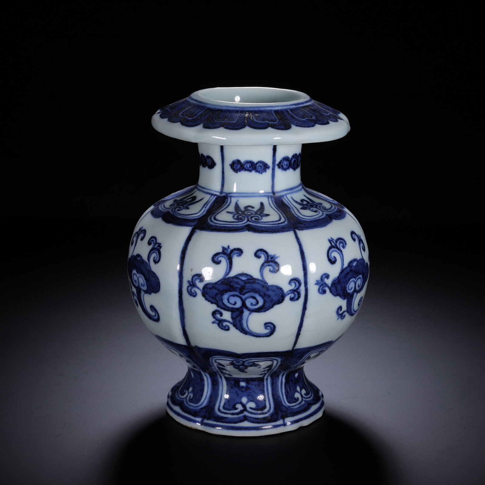 Chinese Blue and White Floral Lobed Vase: Chinese Blue and White Floral Lobed Vase A lobed porcelain vase painted in deep underglaze blue on a crisp white ground. The form features a flared petal-rim mouth, short neck, bulbous faceted body, a