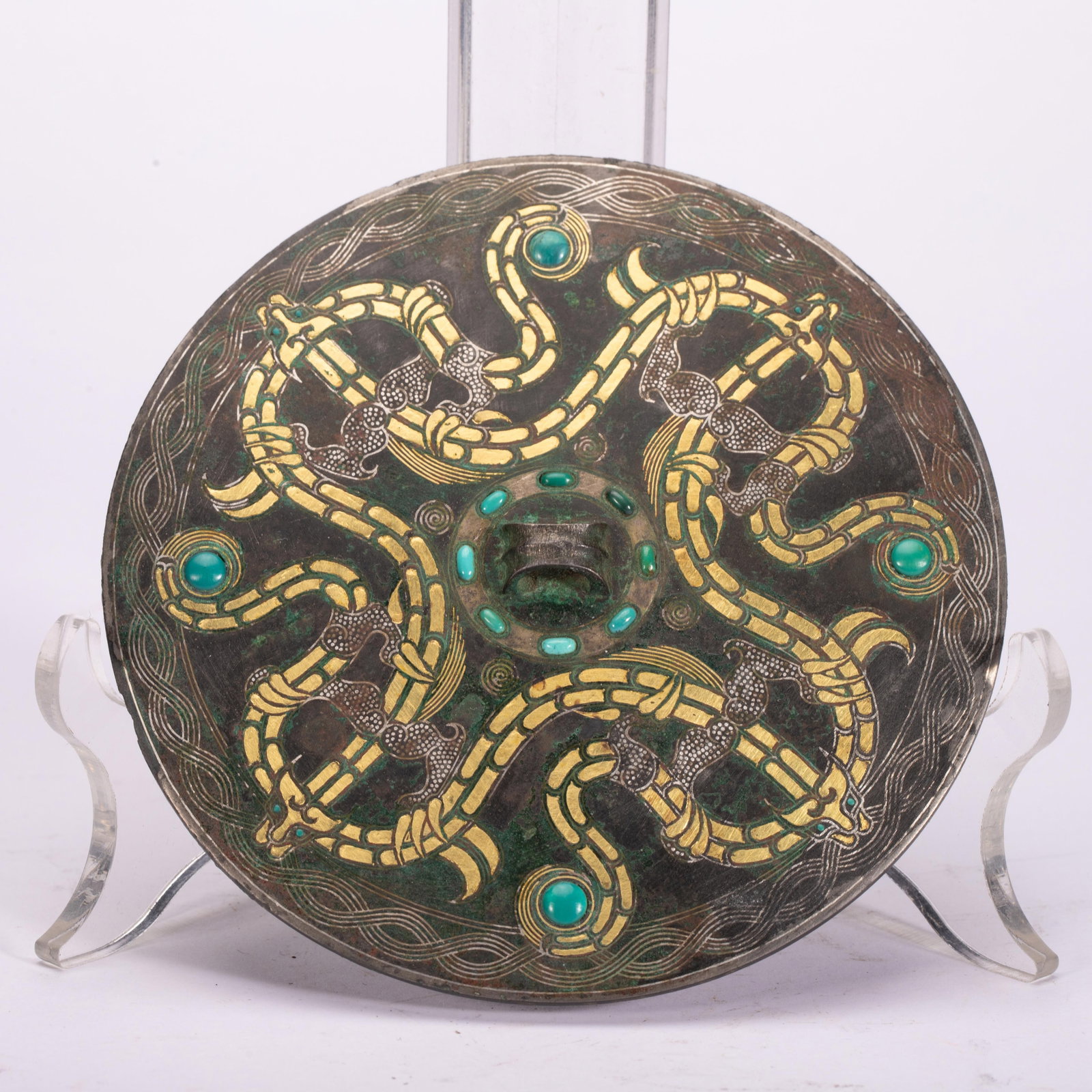 Chinese Gold and Silver Inlaid Turquoise-Inset Bronze Mirror: Chinese Gold and Silver Inlaid Turquoise-Inset Bronze Mirror A circular bronze mirror with a dark, patinated surface, exquisitely decorated with interwoven dragon motifs inlaid with gold and silver wi
