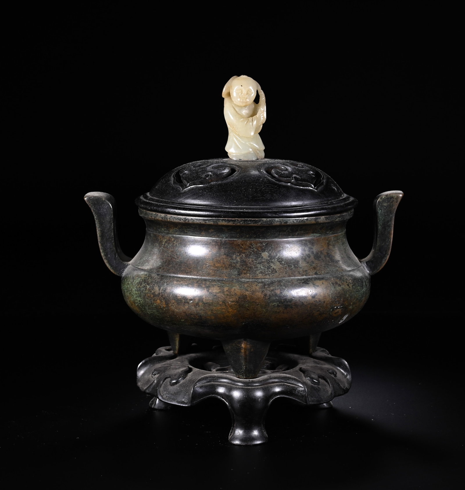 Chinese Bronze Censer with Jade Finial and Wooden Cover: Chinese Bronze Censer with Jade Finial and Wooden Cover This elegant bronze censer measures 21 cm in height and 19.5 cm in width. The body is cast in a classic tripod form with a bulbous body, raised 