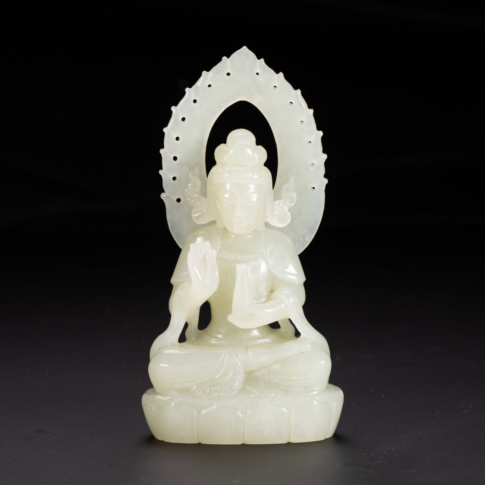 Chinese Hetian White Jade Guanyin Statue: Chinese Hetian White Jade Guanyin Statue A finely carved seated figure of Guanyin, crafted from lustrous Hetian white jade. The bodhisattva is depicted in a serene meditative pose atop a lotus throne,